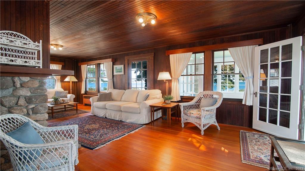 106 East Shore Avenue Groton, CT 06340 - Photo 11 of 39 a living room with furniture and a floor to ceiling window