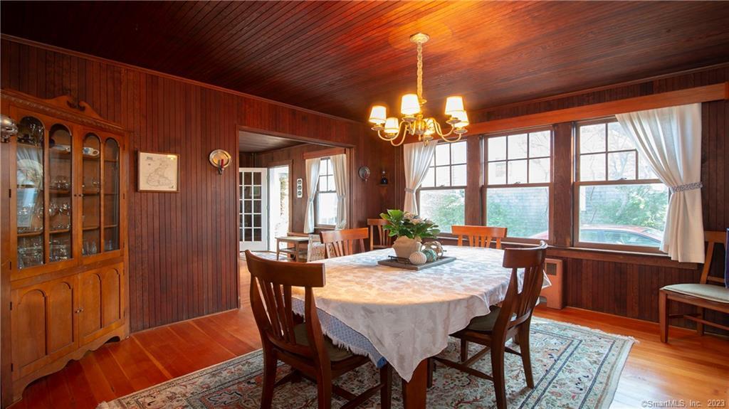 106 East Shore Avenue Groton, CT 06340 - Photo 13 of 39 a view of a dining room with furniture window and wooden floor