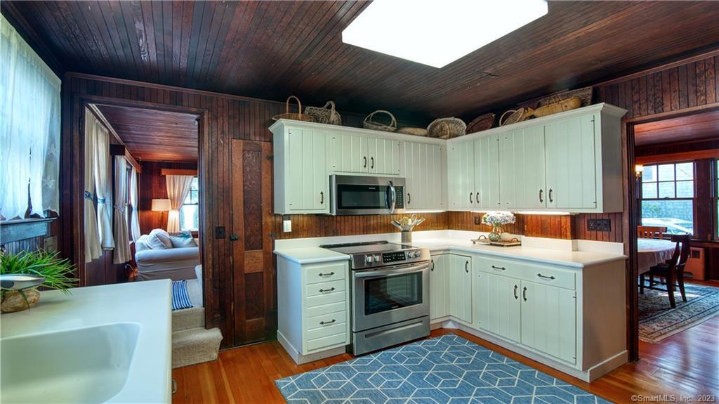 106 East Shore Avenue Groton, CT 06340 - Photo 15 of 39 a kitchen with a stove a sink and a refrigerator