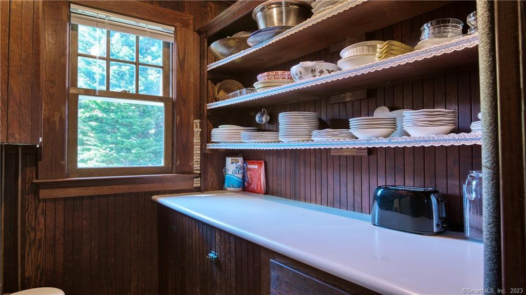 106 East Shore Avenue Groton, CT 06340 - Photo 16 of 39 a kitchen with stainless steel appliances a sink and a cabinets
