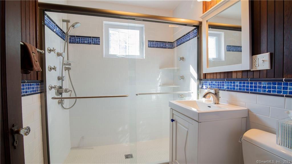 106 East Shore Avenue Groton, CT 06340 - Photo 19 of 39 a bathroom with a sink a toilet and a shower