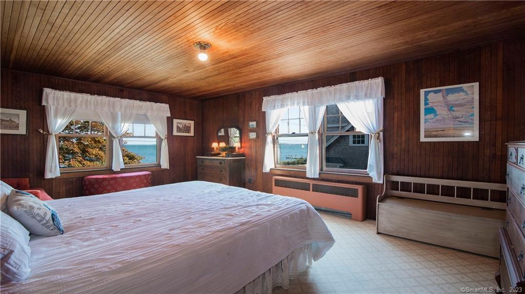 106 East Shore Avenue Groton, CT 06340 - Photo 20 of 39 a bedroom with a large bed and a large window