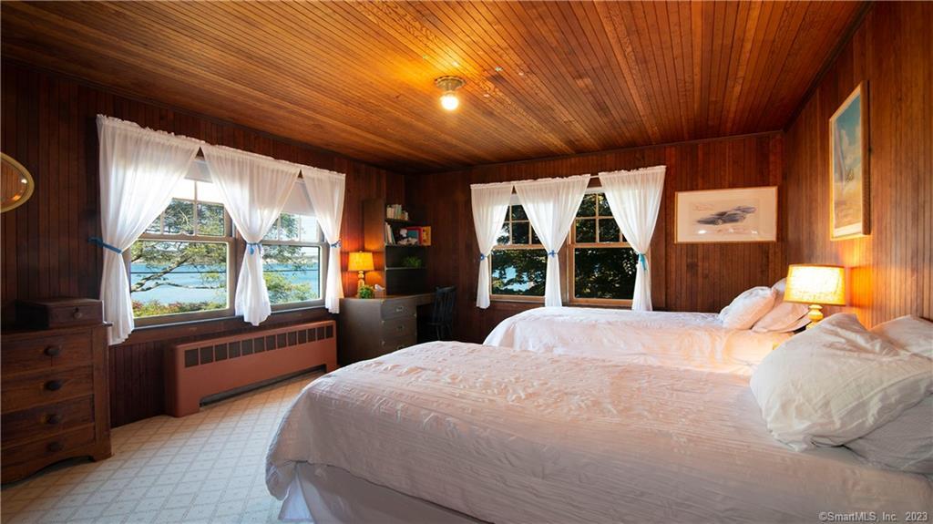 106 East Shore Avenue Groton, CT 06340 - Photo 21 of 39 a bedroom with a large bed and a large window