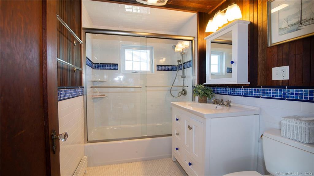 106 East Shore Avenue Groton, CT 06340 - Photo 23 of 39 a bathroom with a sink a mirror and a shower