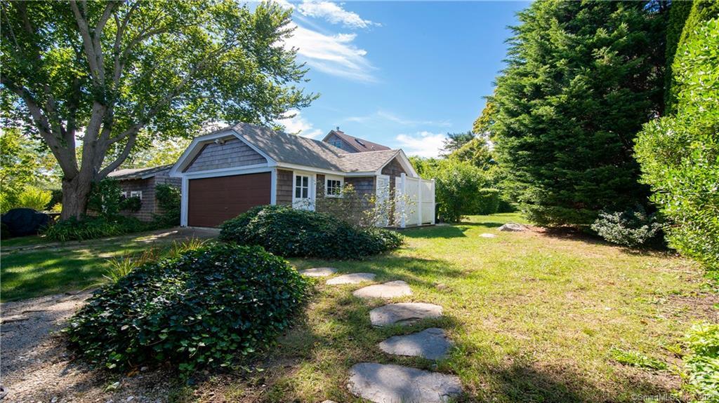 106 East Shore Avenue Groton, CT 06340 - Photo 5 of 39 a front view of a house with a yard