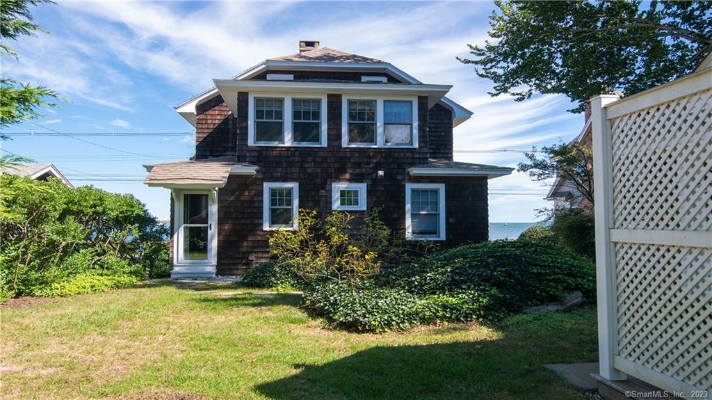 106 East Shore Avenue Groton, CT 06340 - Photo 8 of 39 a front view of a house with a yard