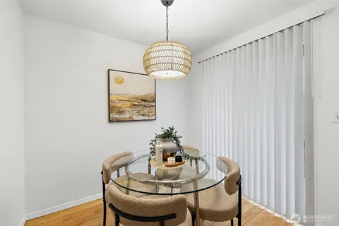 a dining room with furniture and window