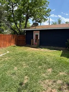 a view of backyard with large trees