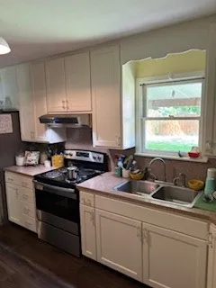 a kitchen with a stove and a sink