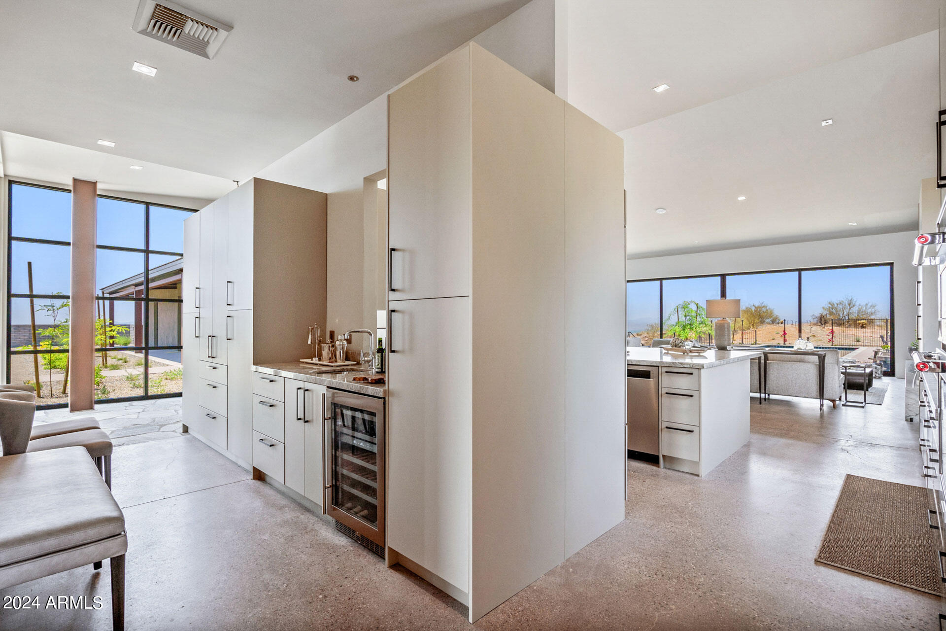 15310 North Sandy Bluff Road Fort McDowell, AZ 85264 - Photo 11 of 58 a kitchen with white cabinets and stainless steel appliances