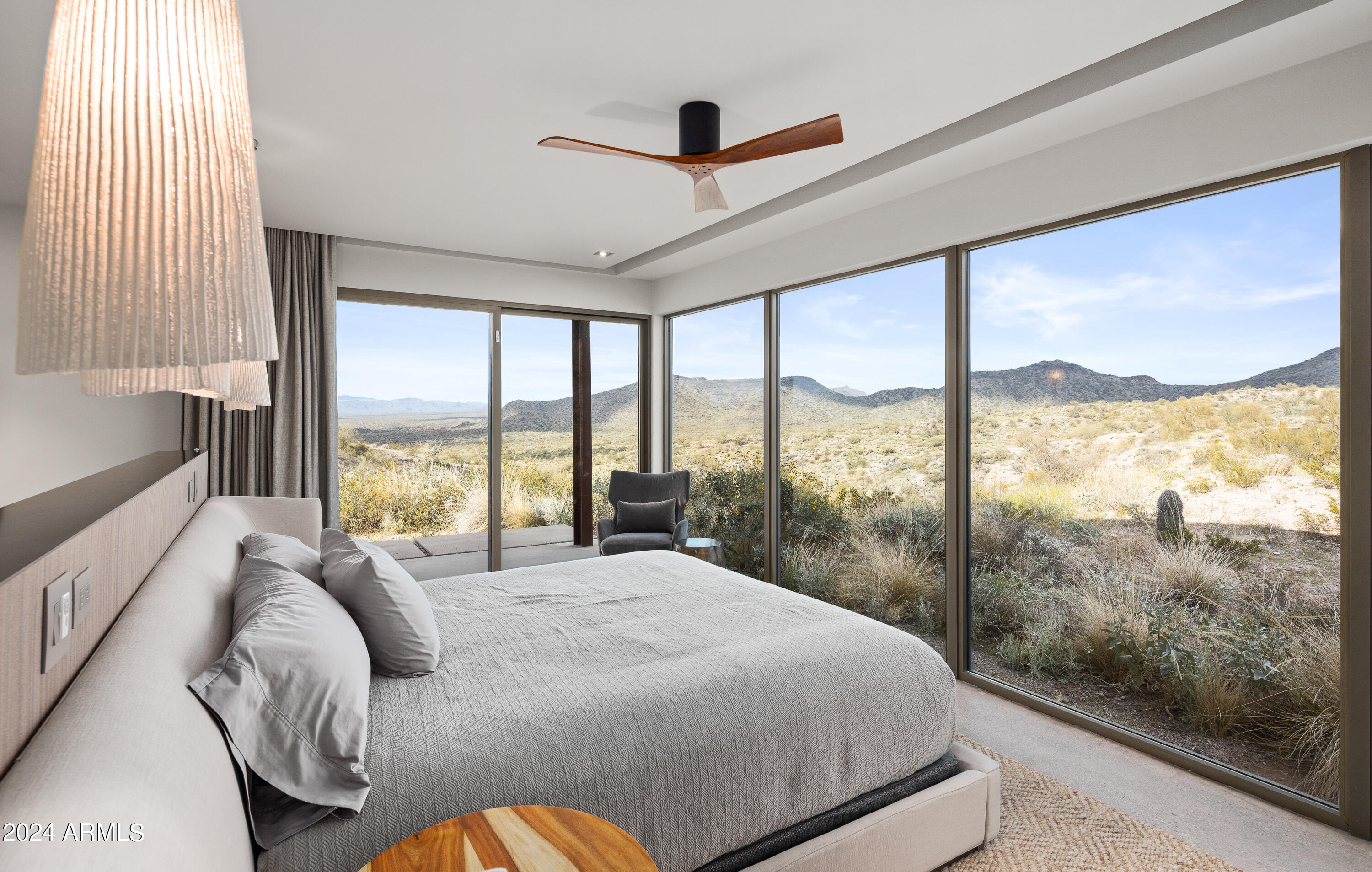 15310 North Sandy Bluff Road Fort McDowell, AZ 85264 - Photo 14 of 58 a bedroom with a large bed and a large window