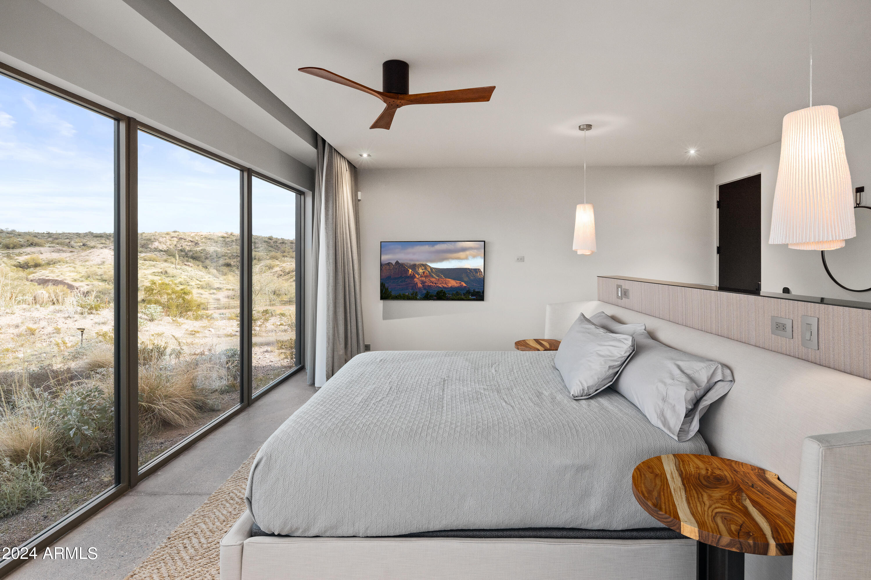 15310 North Sandy Bluff Road Fort McDowell, AZ 85264 - Photo 15 of 58 a bedroom with a large bed and a chandelier