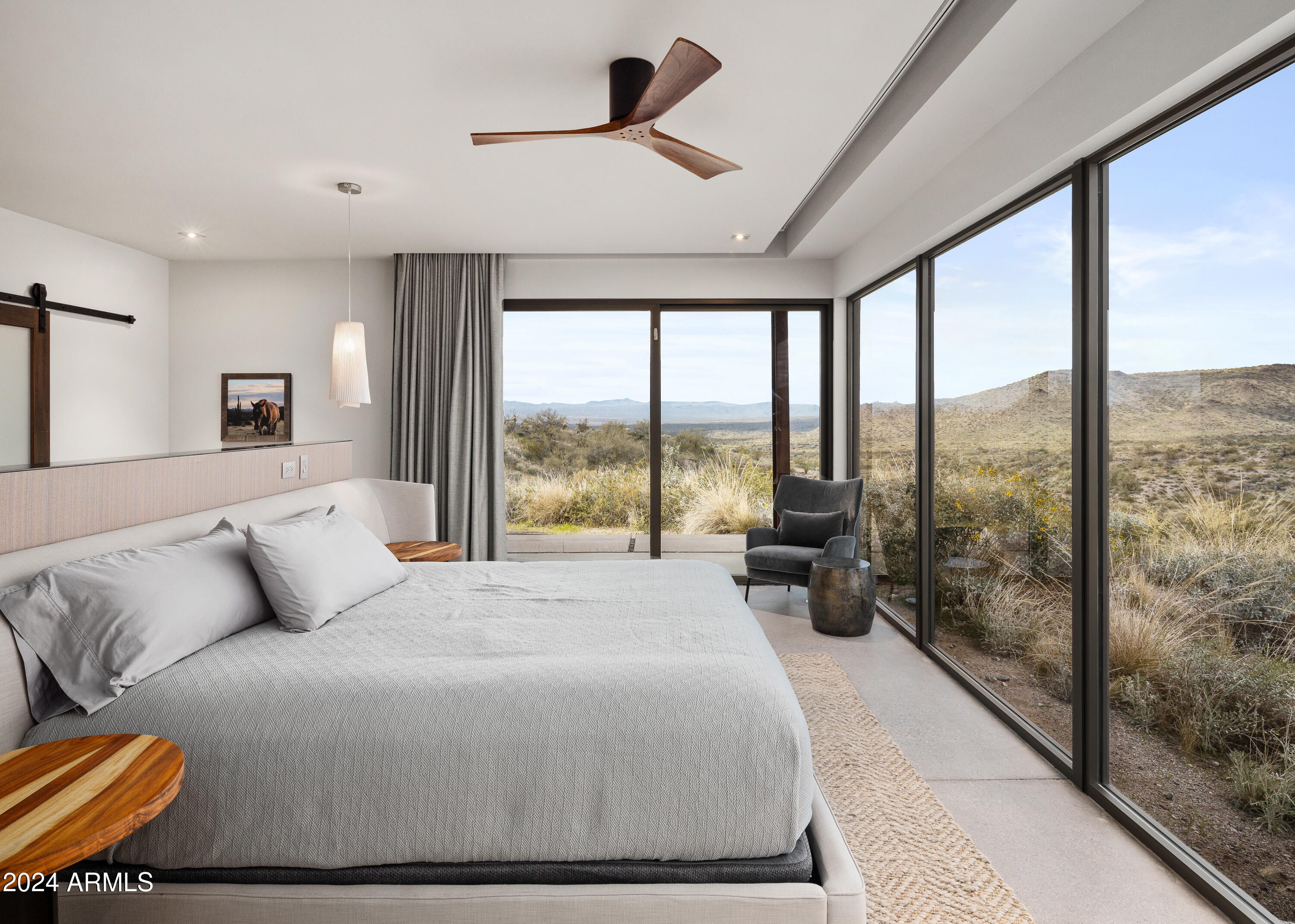 15310 North Sandy Bluff Road Fort McDowell, AZ 85264 - Photo 17 of 58 a bedroom with a bed and large windows