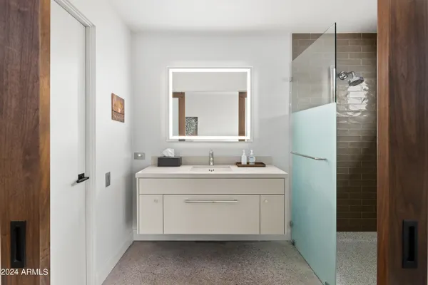 a bedroom with bed and window