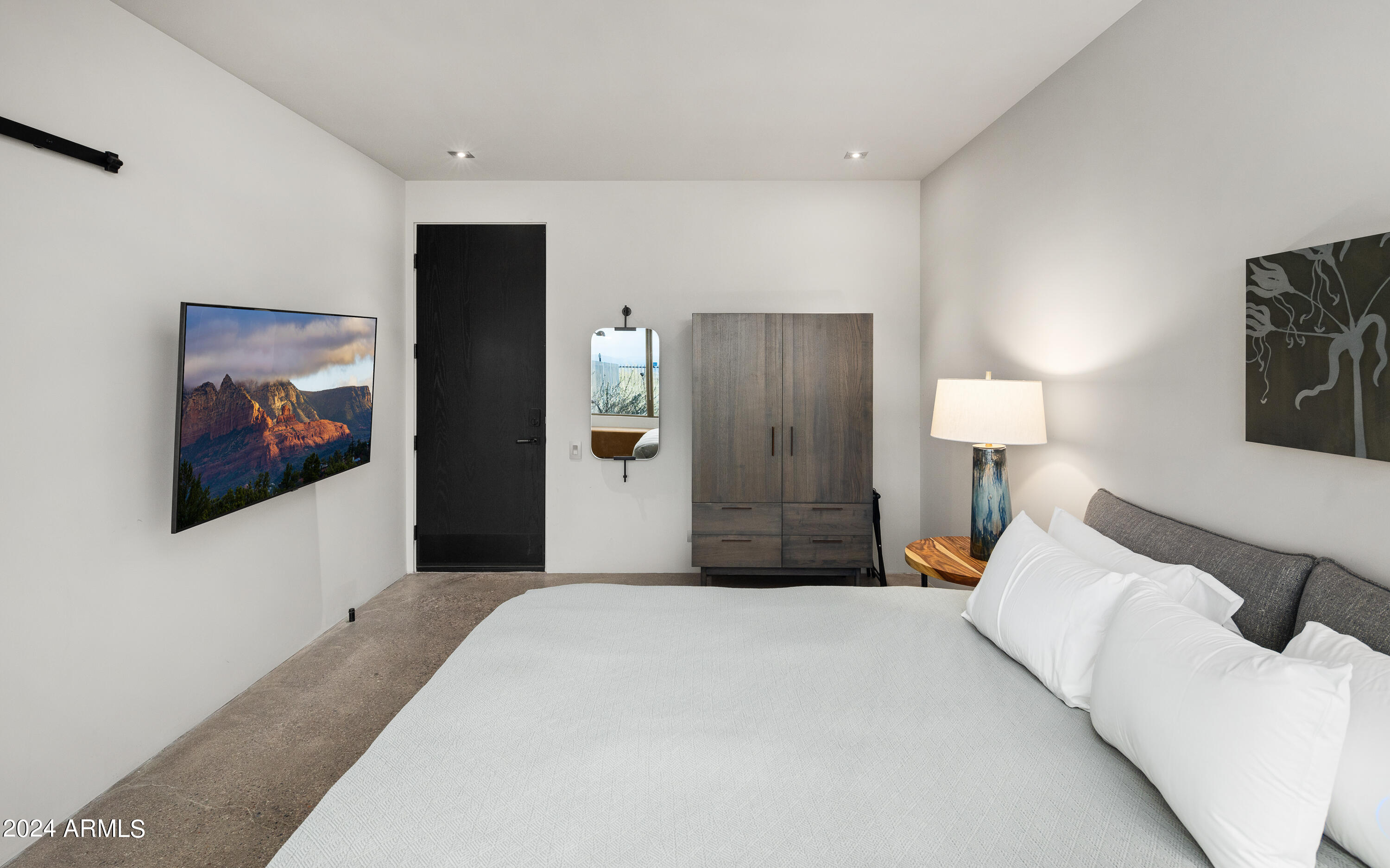 15310 North Sandy Bluff Road Fort McDowell, AZ 85264 - Photo 25 of 58 a bedroom with a bed and a painting on the wall