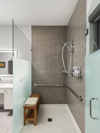 a bedroom with two large bed and a large window