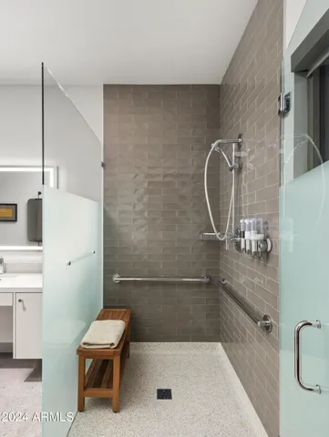 a bedroom with two large bed and a large window