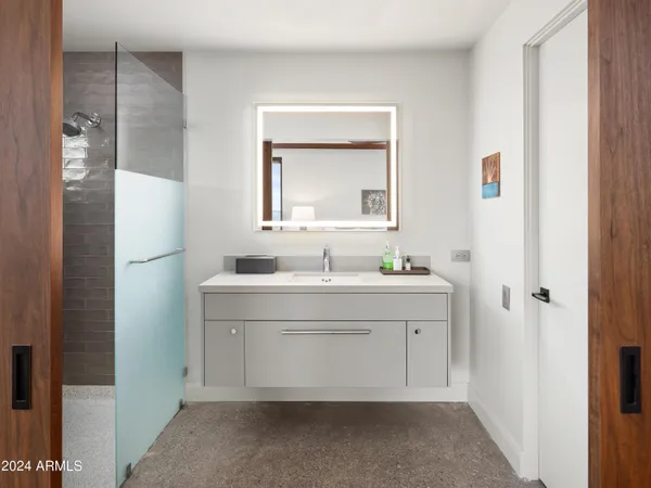 a bedroom with a large bed and a balcony view