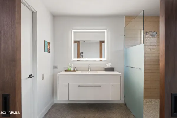 a living room with furniture ceiling fan and a window