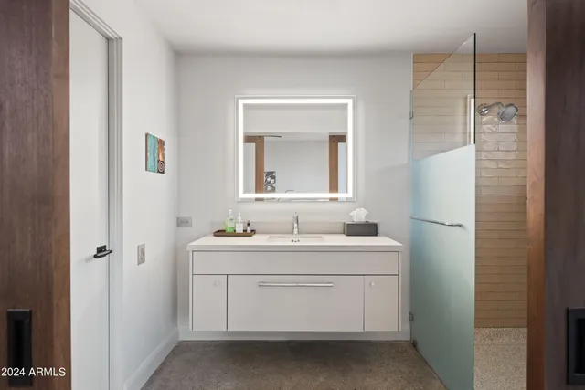 a living room with furniture ceiling fan and a window
