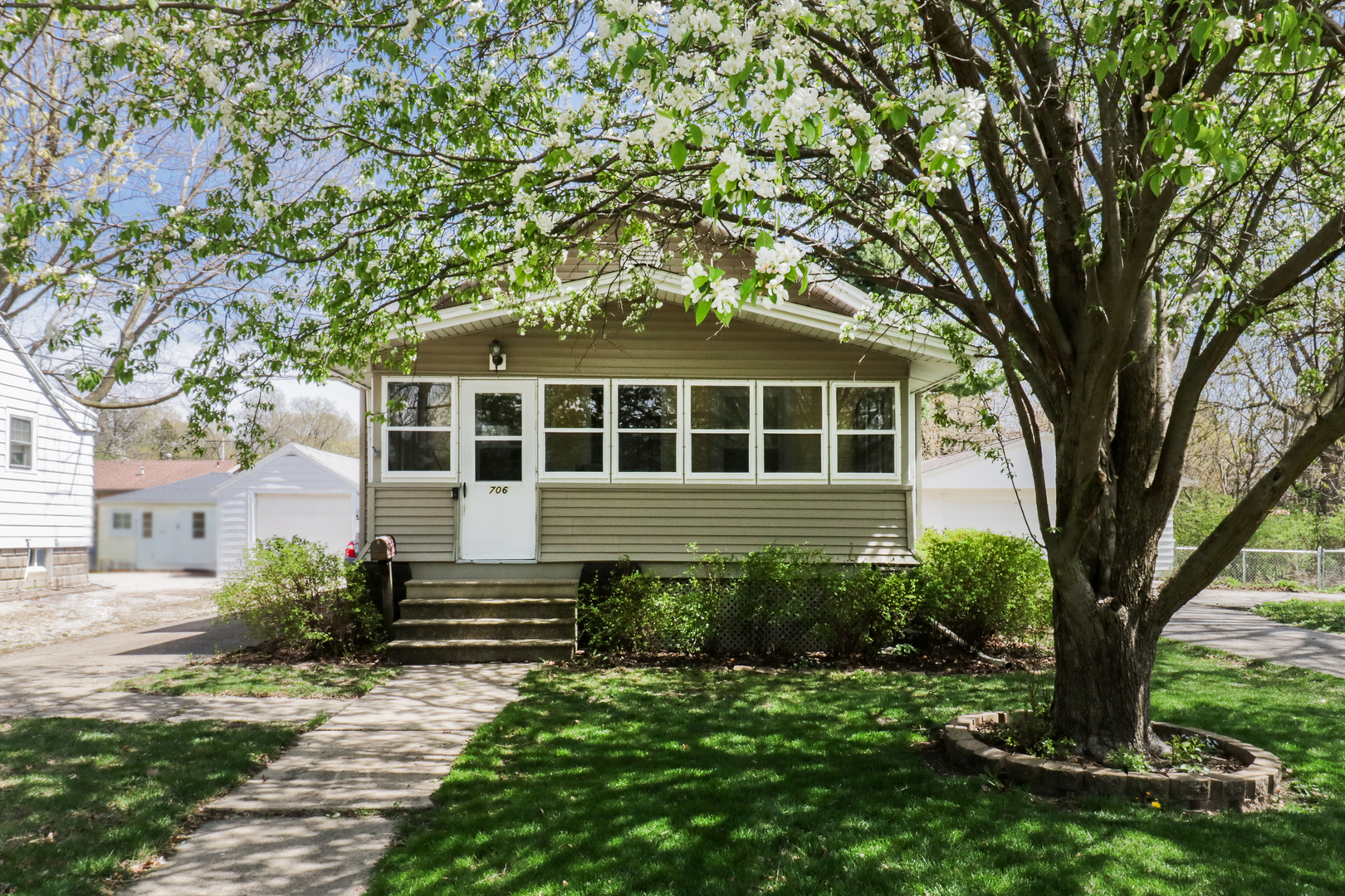 706 Vale Street Bloomington, IL 61701 - Photo 1 of 46 a front view of a house with a yard