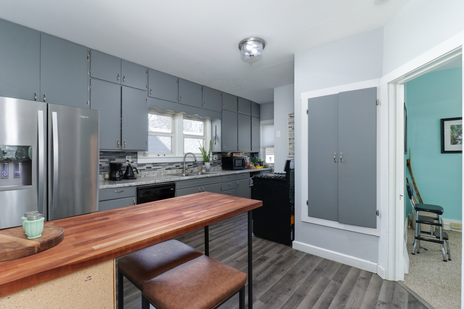 706 Vale Street Bloomington, IL 61701 - Photo 12 of 46 a kitchen with a table and chairs