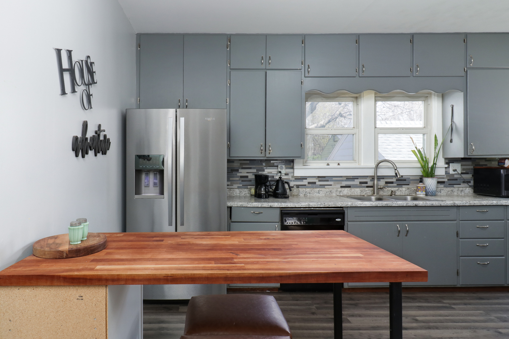 706 Vale Street Bloomington, IL 61701 - Photo 13 of 46 a kitchen with kitchen island a sink refrigerator and window