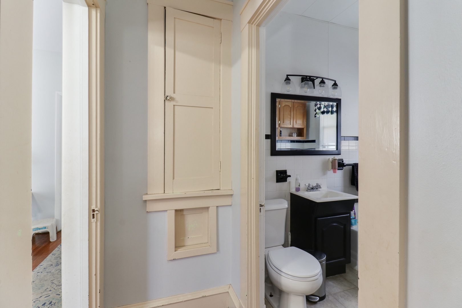 706 Vale Street Bloomington, IL 61701 - Photo 19 of 46 a bathroom with a toilet sink and mirror