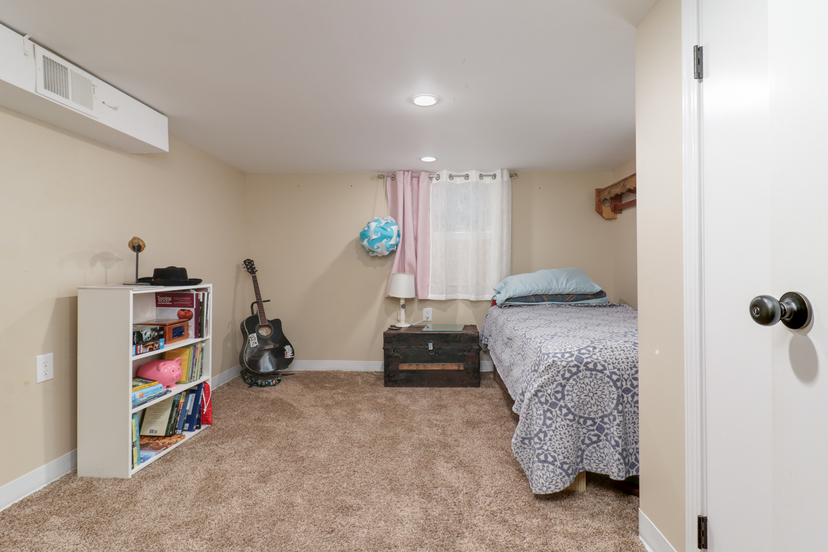 706 Vale Street Bloomington, IL 61701 - Photo 24 of 46 a bedroom with furniture and a book shelf