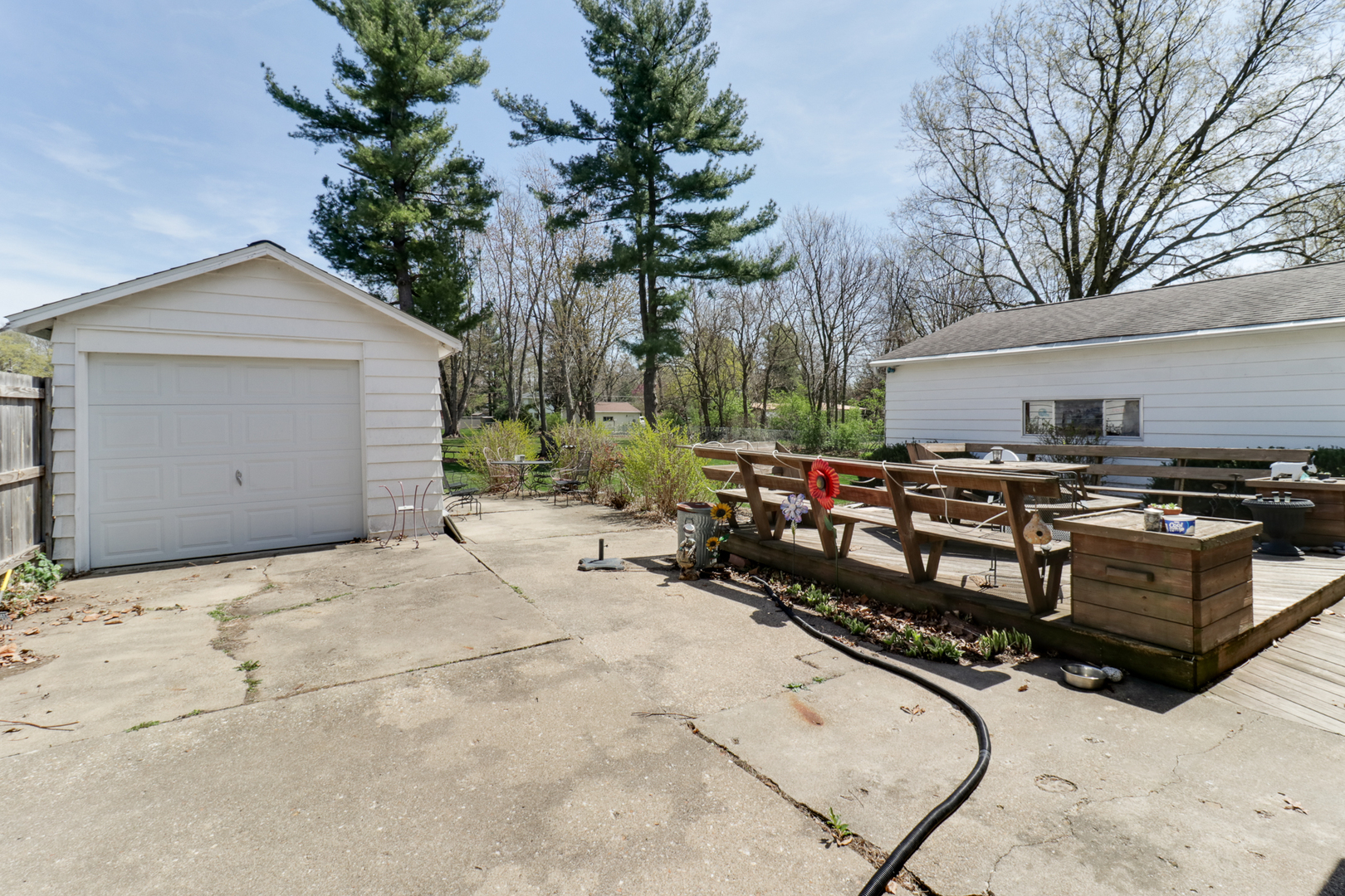 706 Vale Street Bloomington, IL 61701 - Photo 30 of 46 a view of a roof deck with wooden fence and plants