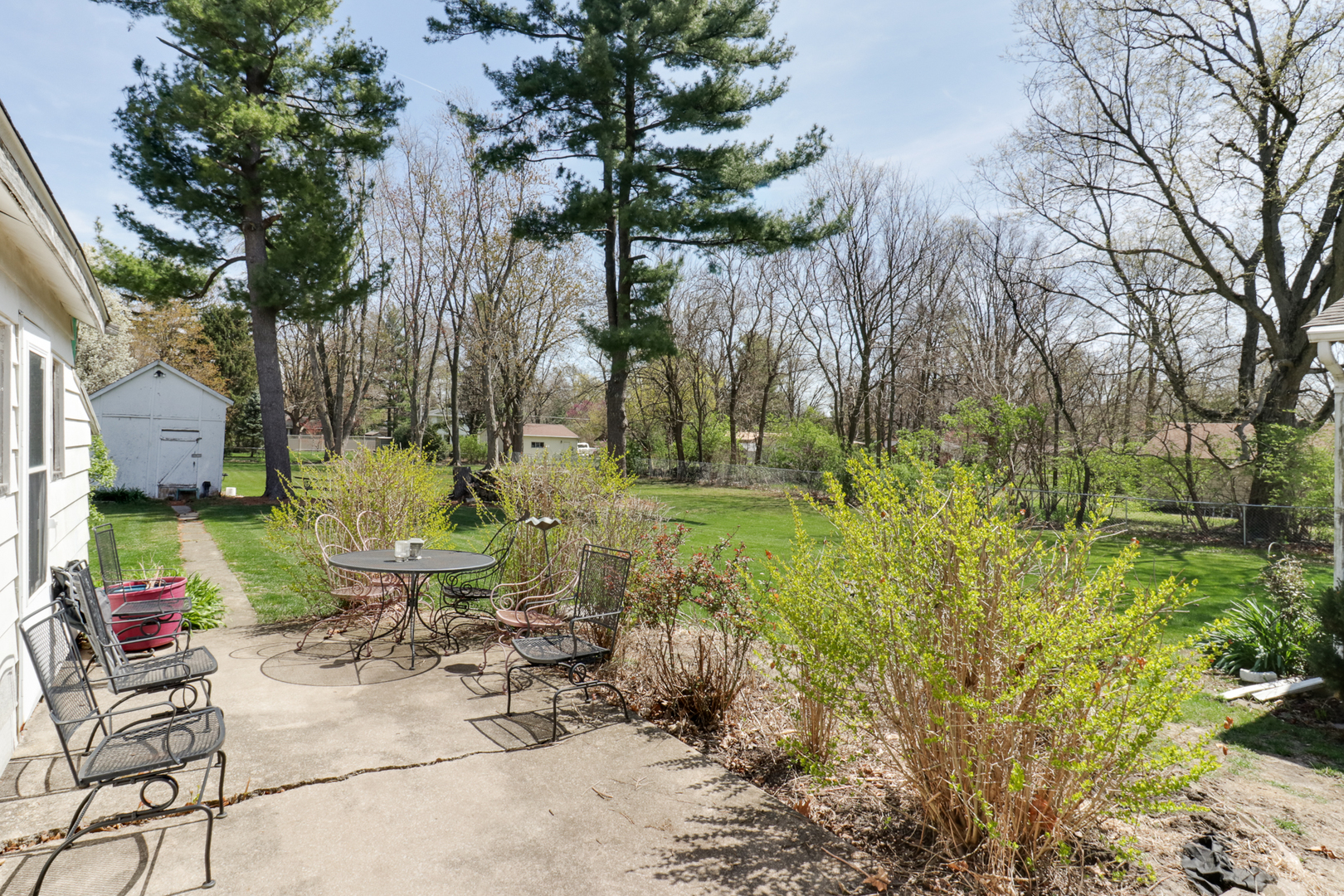 706 Vale Street Bloomington, IL 61701 - Photo 34 of 46 a view of backyard with plants and outdoor seating