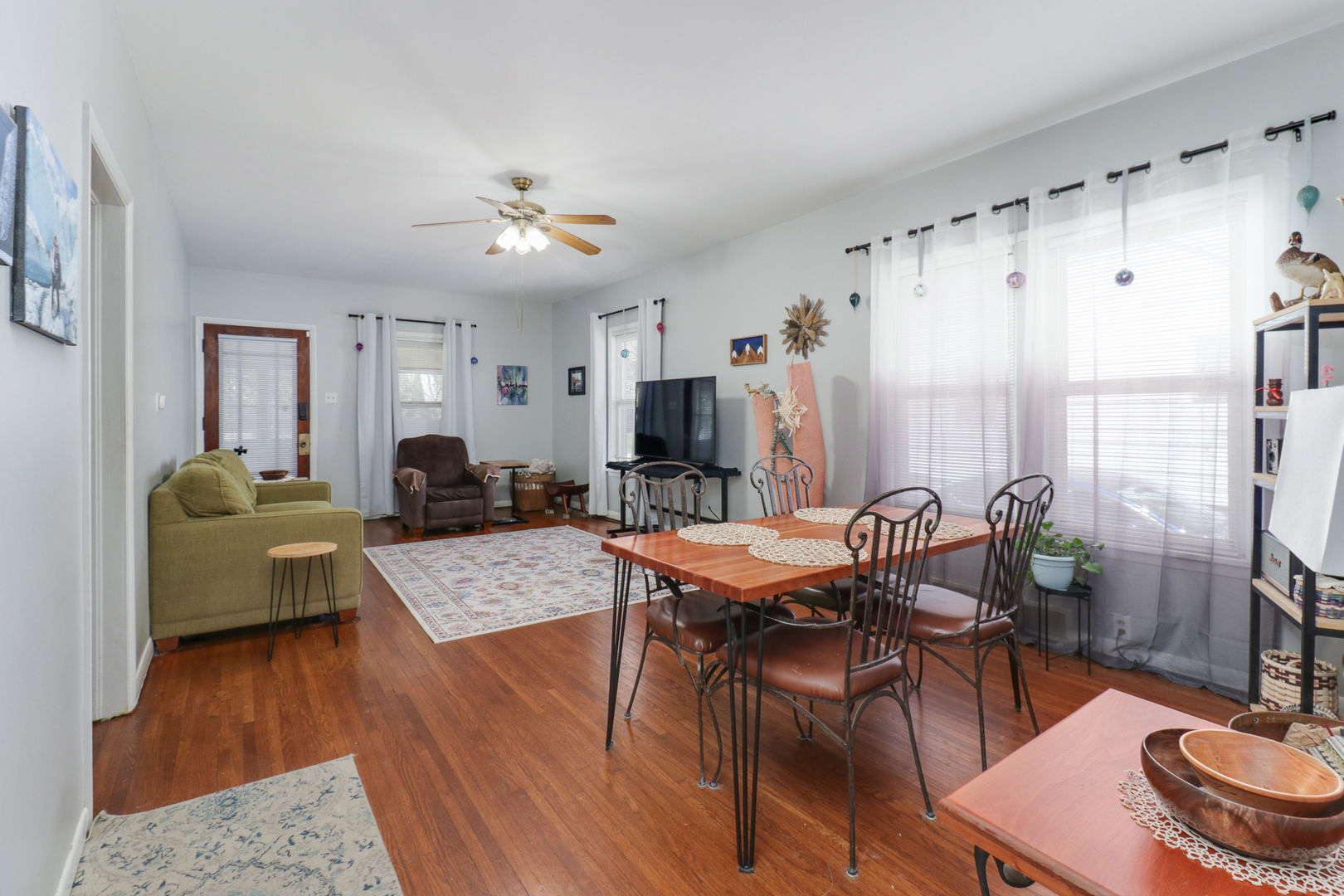 706 Vale Street Bloomington, IL 61701 - Photo 8 of 46 a living room with furniture a table and a chandelier