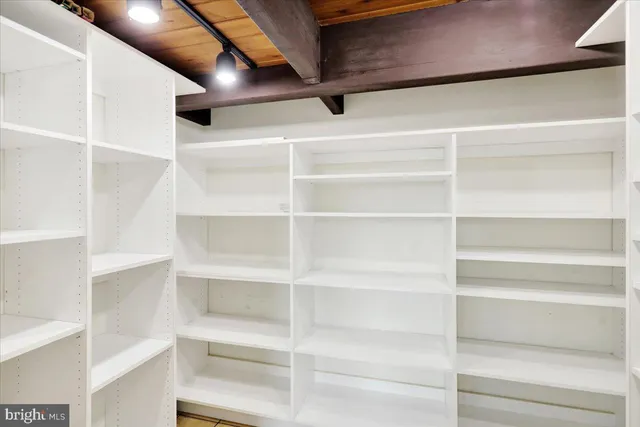 a view of a livingroom with furniture and a window