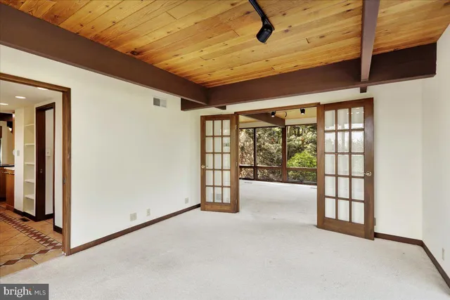a room with fireplace and outdoor seating