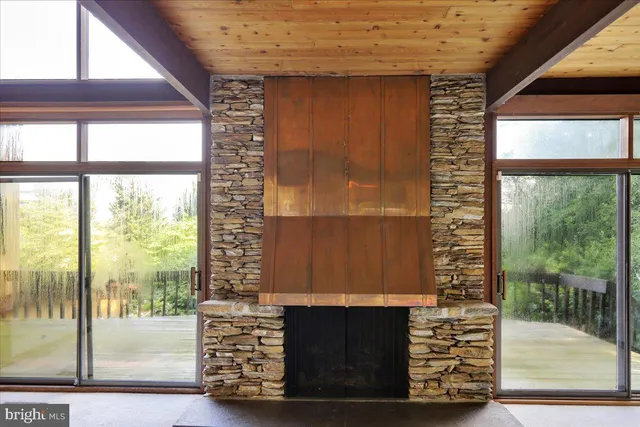 a view of an empty room with a balcony