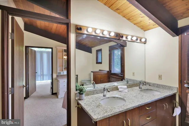 a view of a porch with wooden floor and outer view