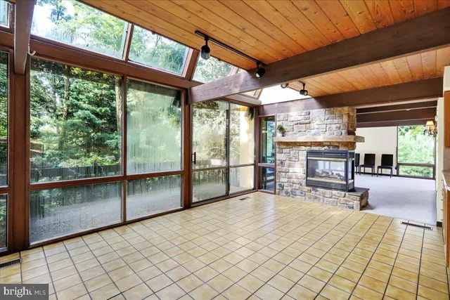 a kitchen with stainless steel appliances granite countertop a sink and a refrigerator