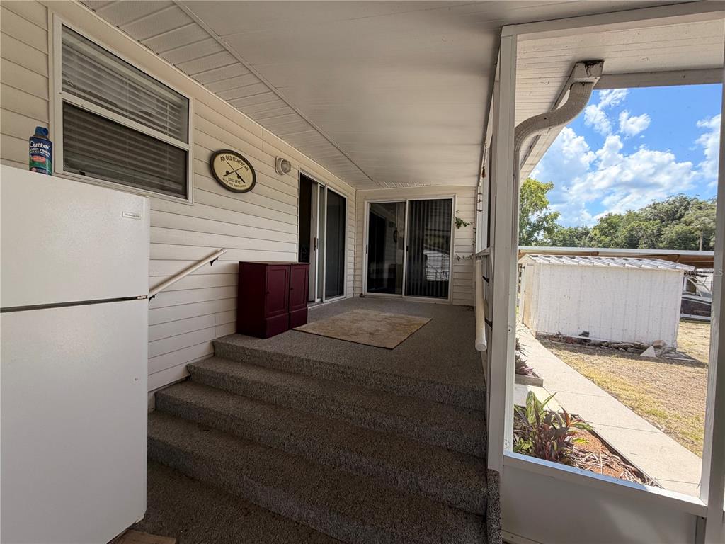 24521 Alligator Road Astor, FL 32102 - Photo 34 of 51 a view of balcony and kitchen
