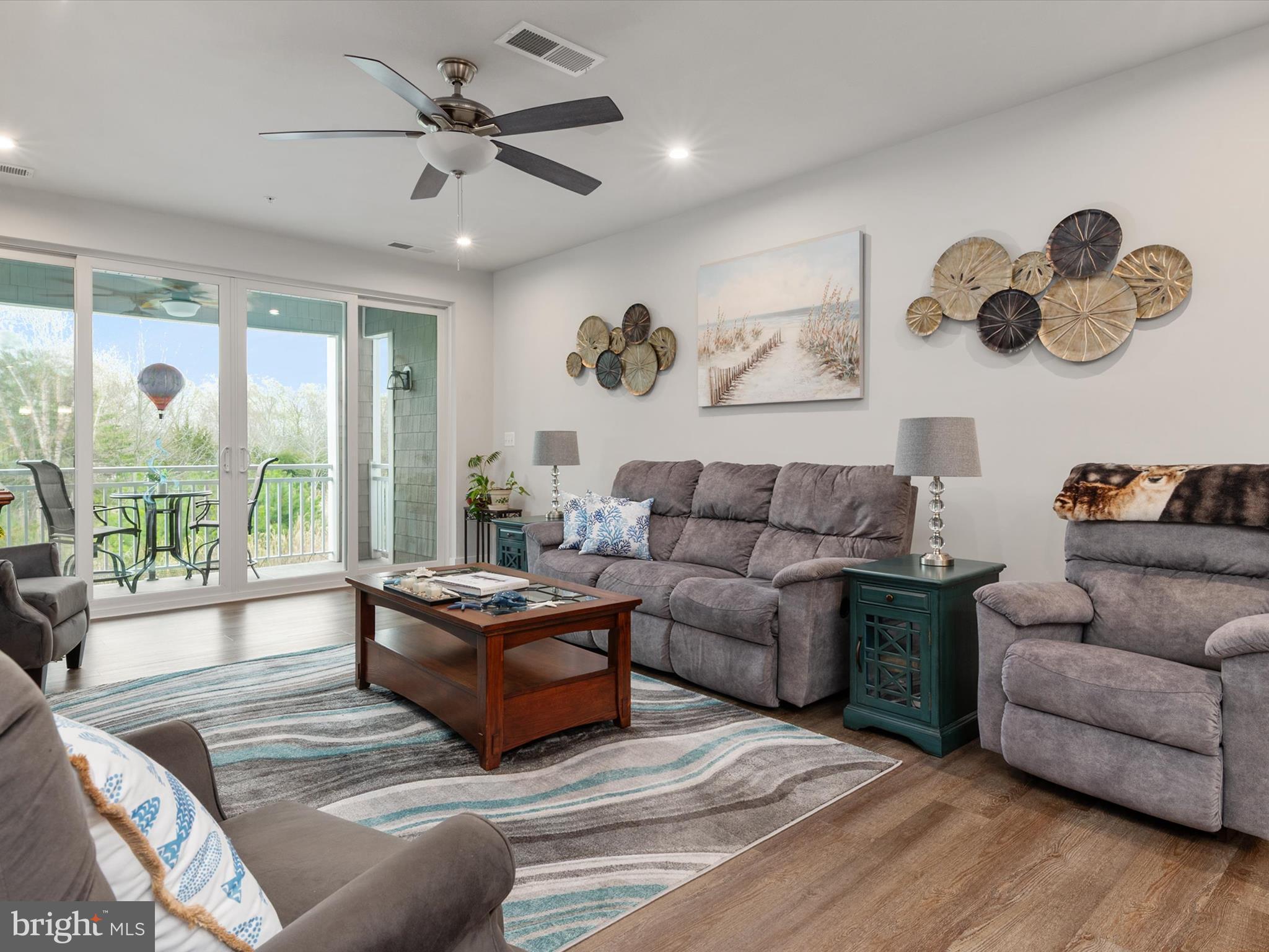1000 Herons Nest Way, Unit 22 Chester, MD 21619 - Photo 20 of 59 a living room with furniture and a large window