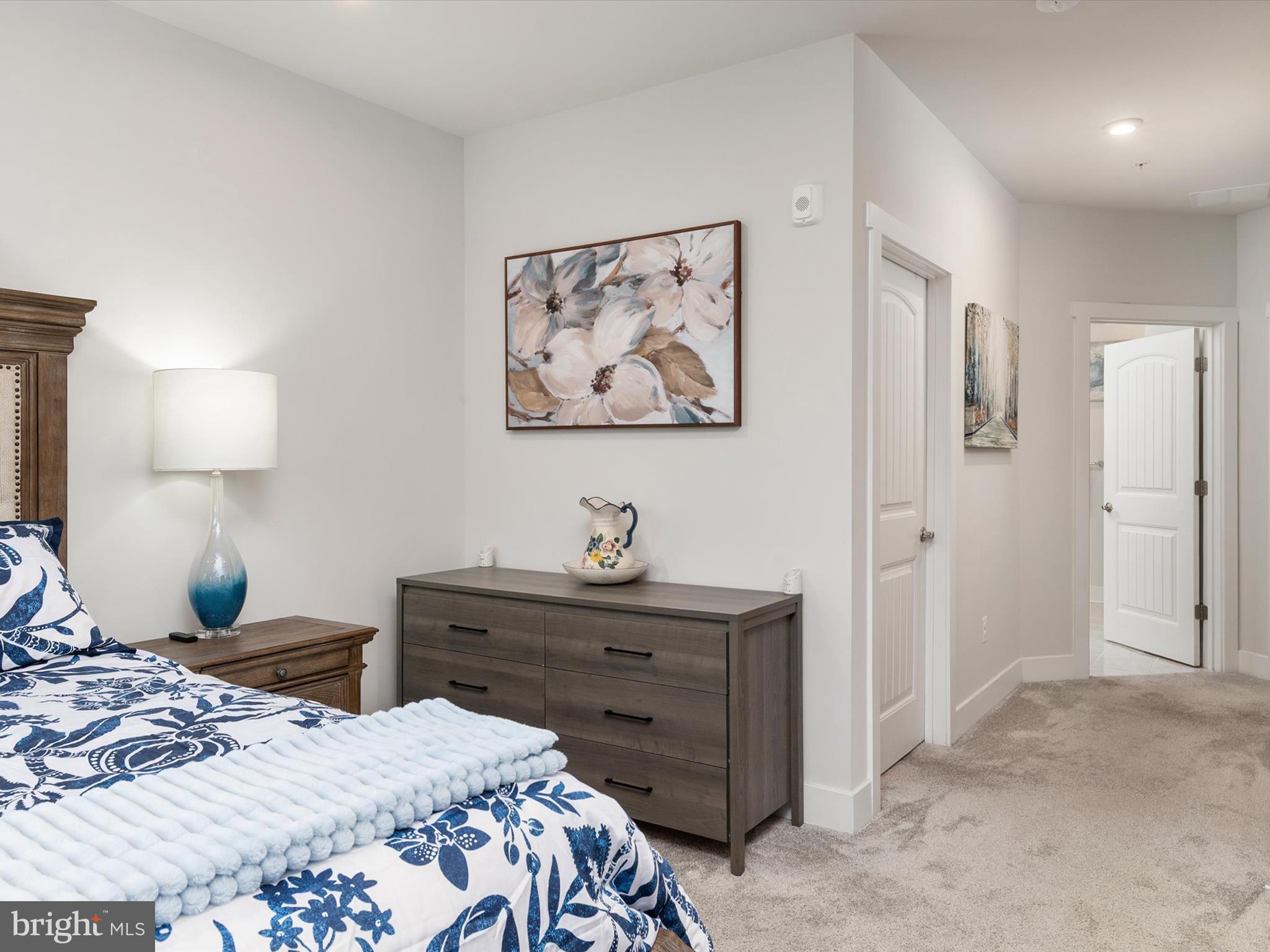 1000 Herons Nest Way, Unit 22 Chester, MD 21619 - Photo 26 of 59 a bedroom with a bed and a painting on the wall