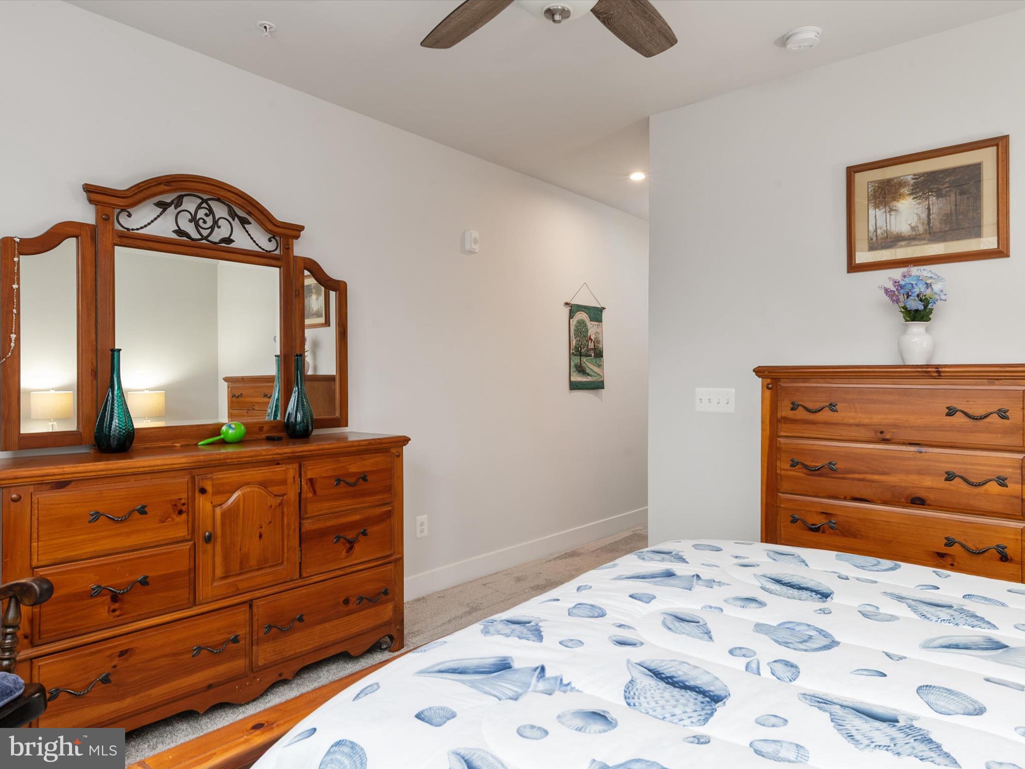 1000 Herons Nest Way, Unit 22 Chester, MD 21619 - Photo 30 of 59 a bedroom with a bed and a dresser