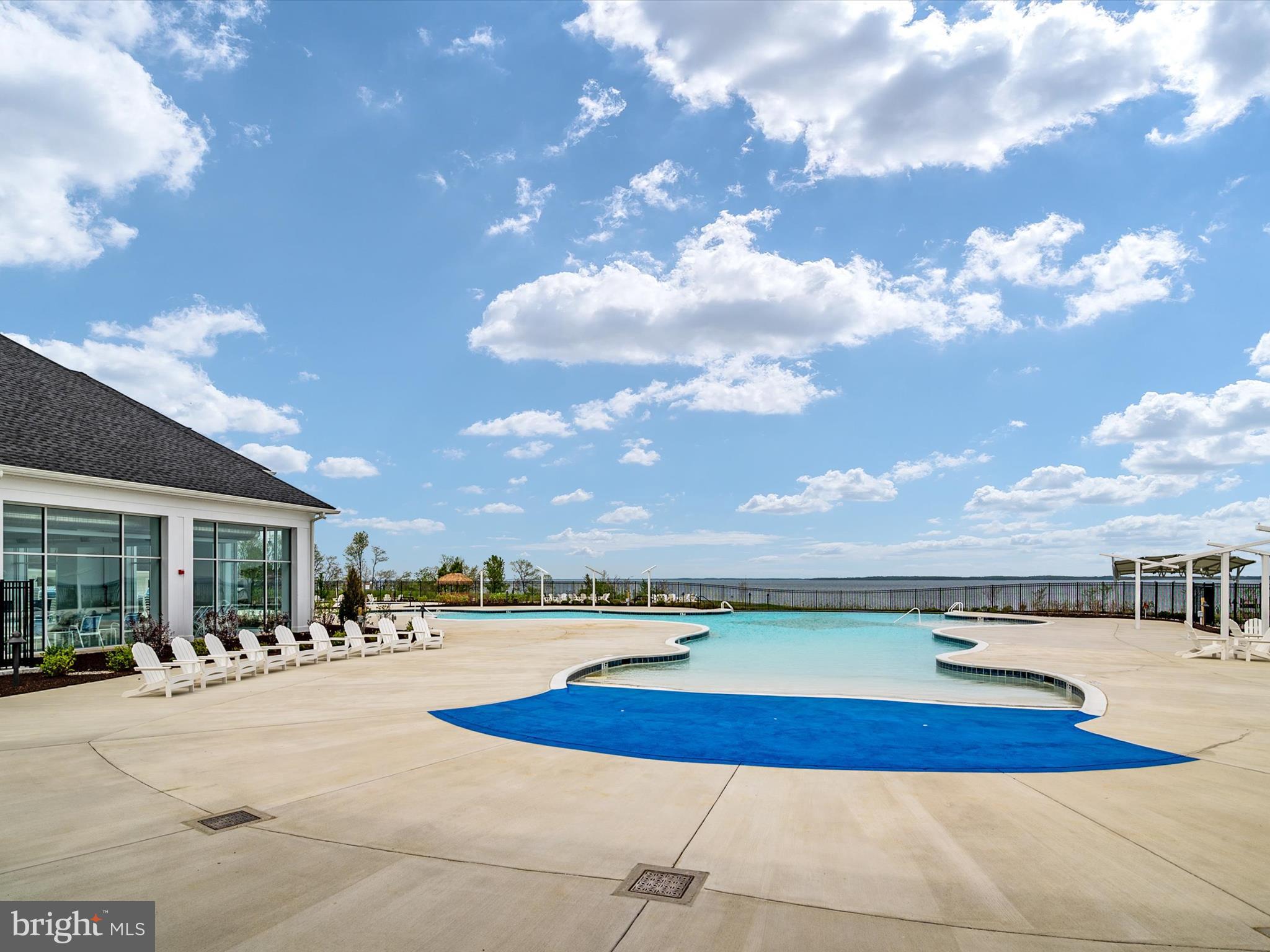 1000 Herons Nest Way, Unit 22 Chester, MD 21619 - Photo 42 of 59 a view of swimming pool with outdoor seating and city view