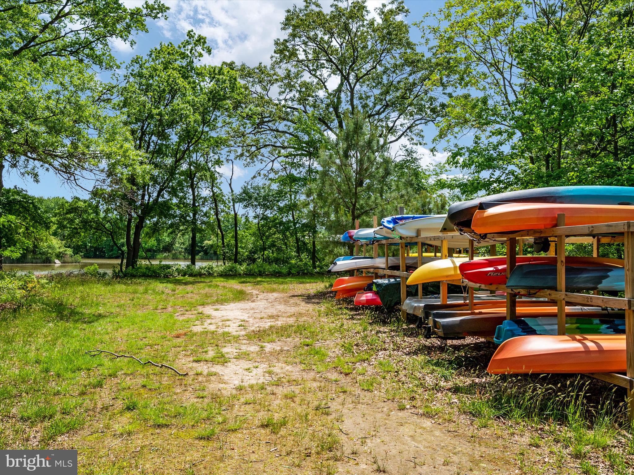 1000 Herons Nest Way, Unit 22 Chester, MD 21619 - Photo 55 of 59 a group of cars parked in front of house