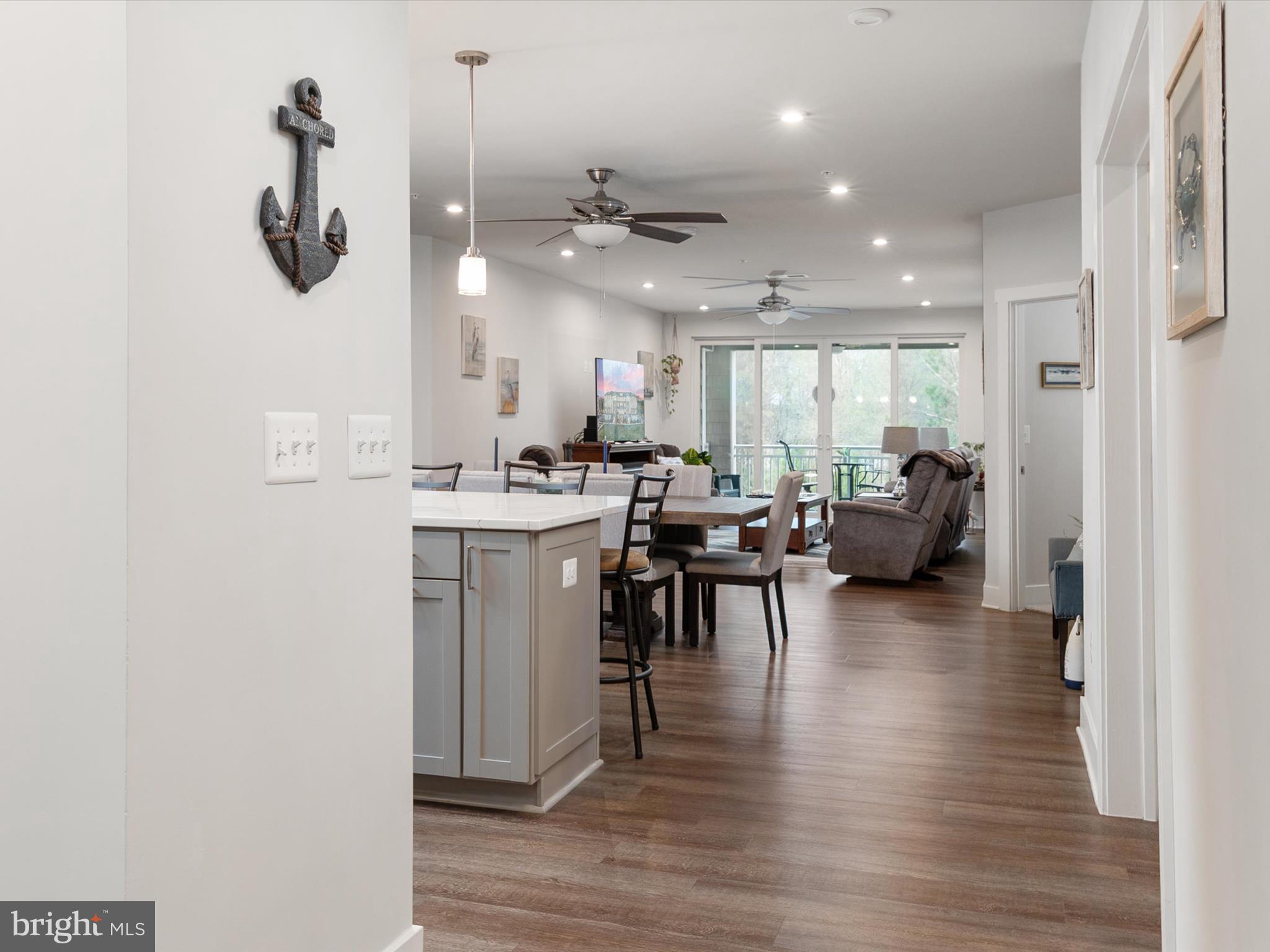 1000 Herons Nest Way, Unit 22 Chester, MD 21619 - Photo 10 of 59 a kitchen with a table chairs and a view of kitchen