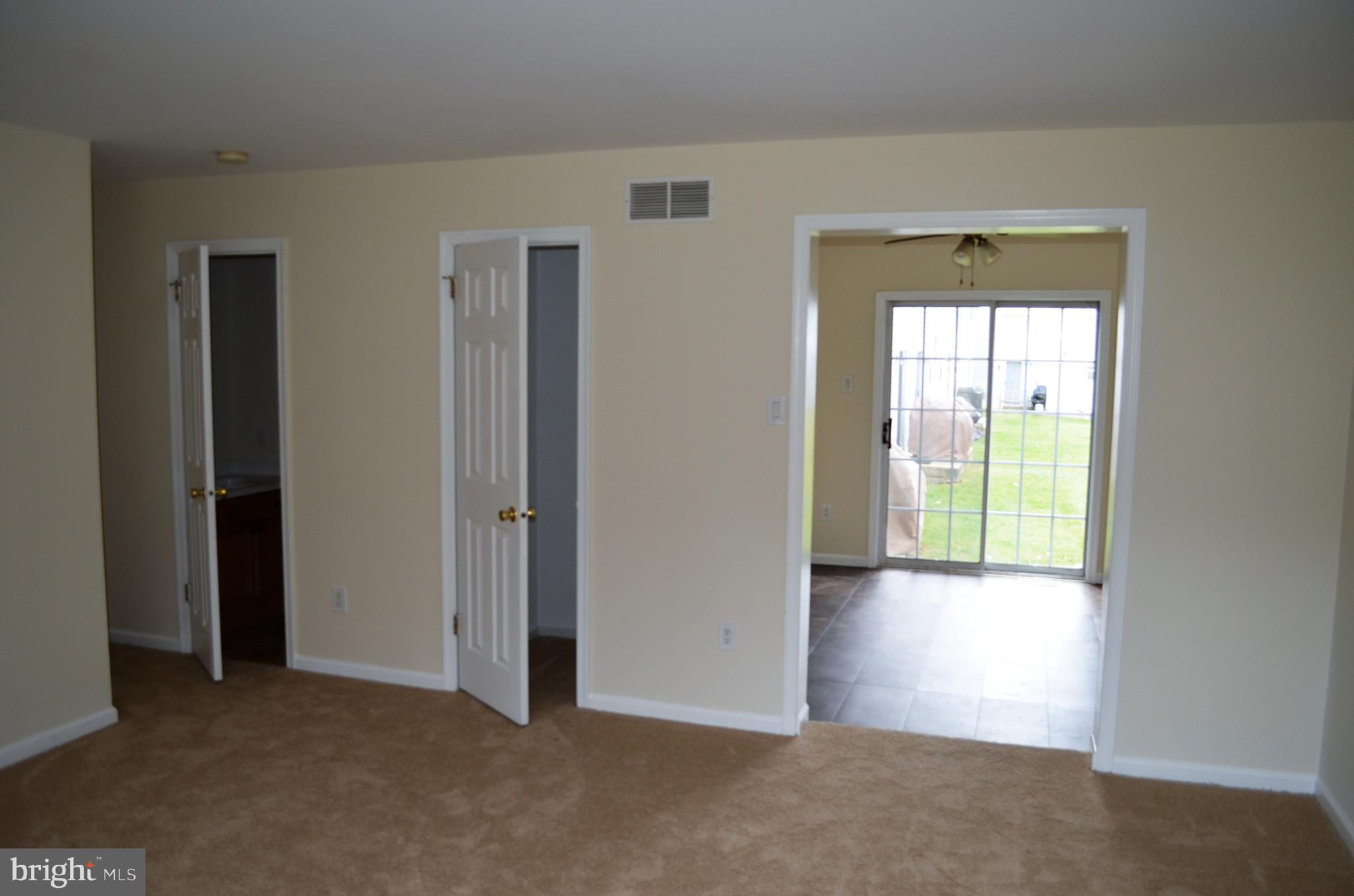 5475 Rinker Circle, Unit 302 Doylestown, PA 18902 - Photo 5 of 13 Family Room / Half Bath / Closet