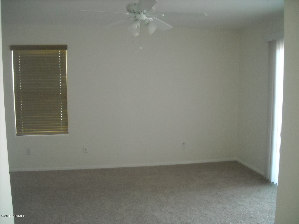 14142 West Boca Raton Road Surprise, AZ 85379 - Photo 9 of 11 an empty room with a window