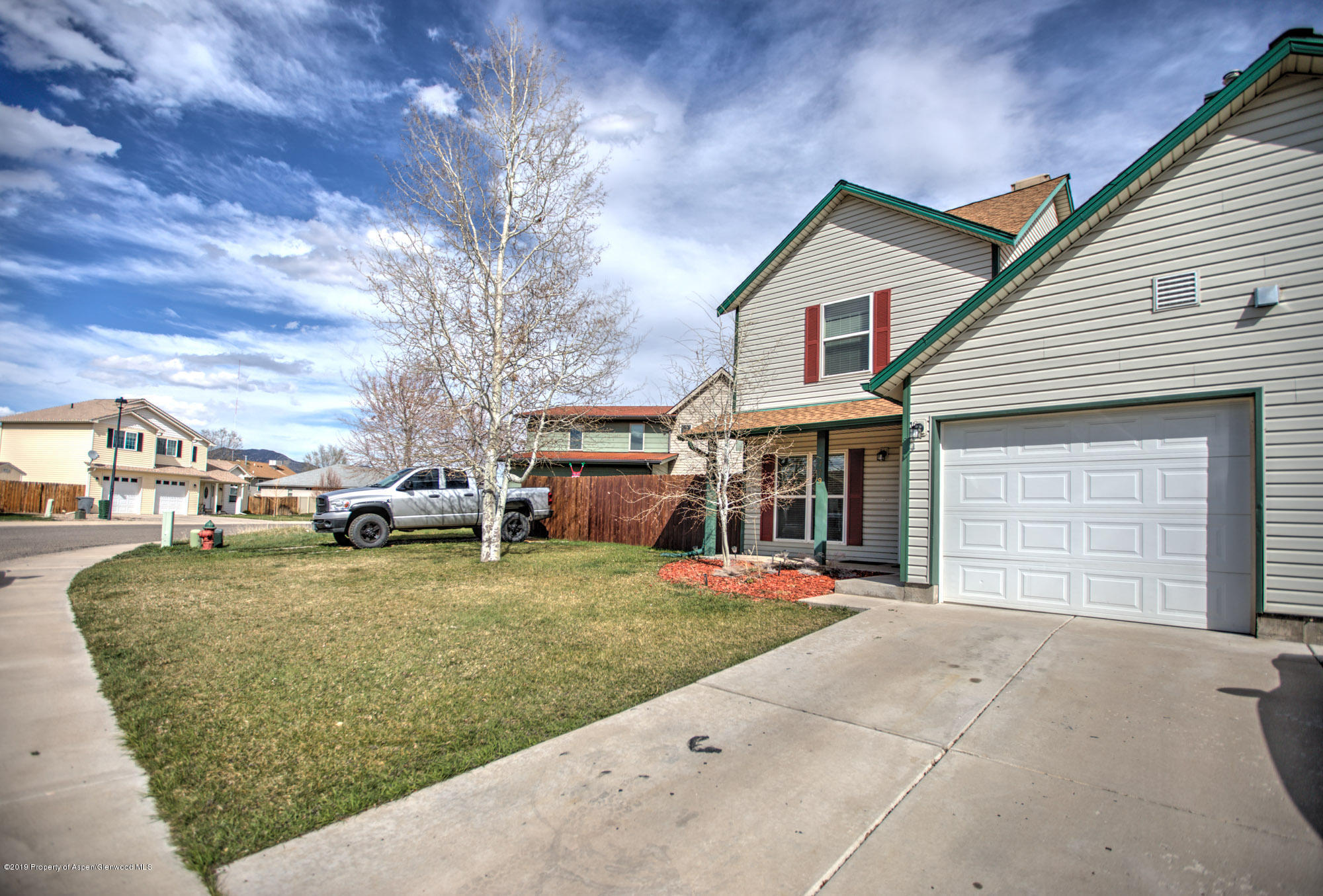 779 East 17th Street Rifle, CO 81650 - Photo 1 of 21 a front view of a house with a yard