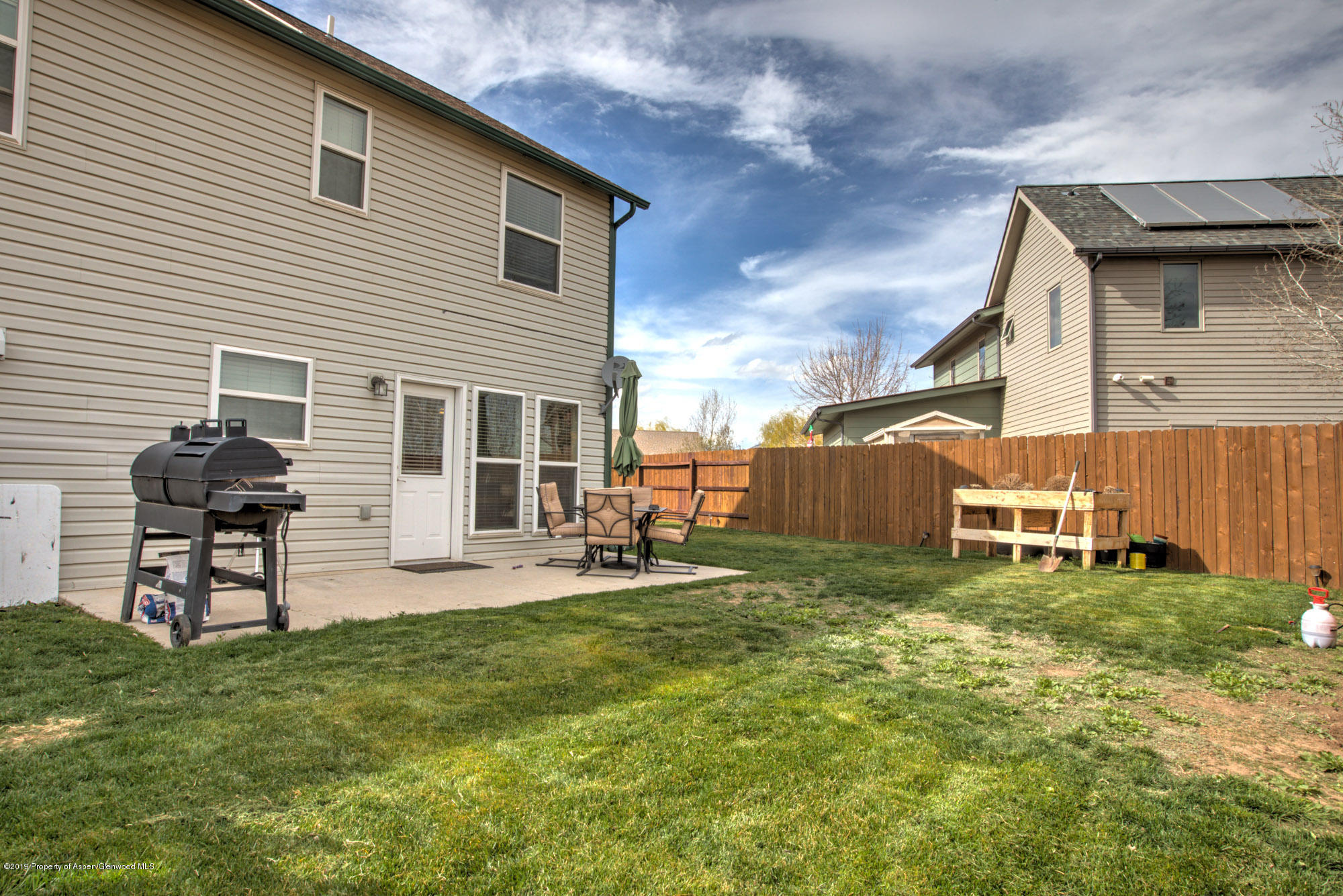 779 East 17th Street Rifle, CO 81650 - Photo 18 of 21 a backyard of a house with table and chairs