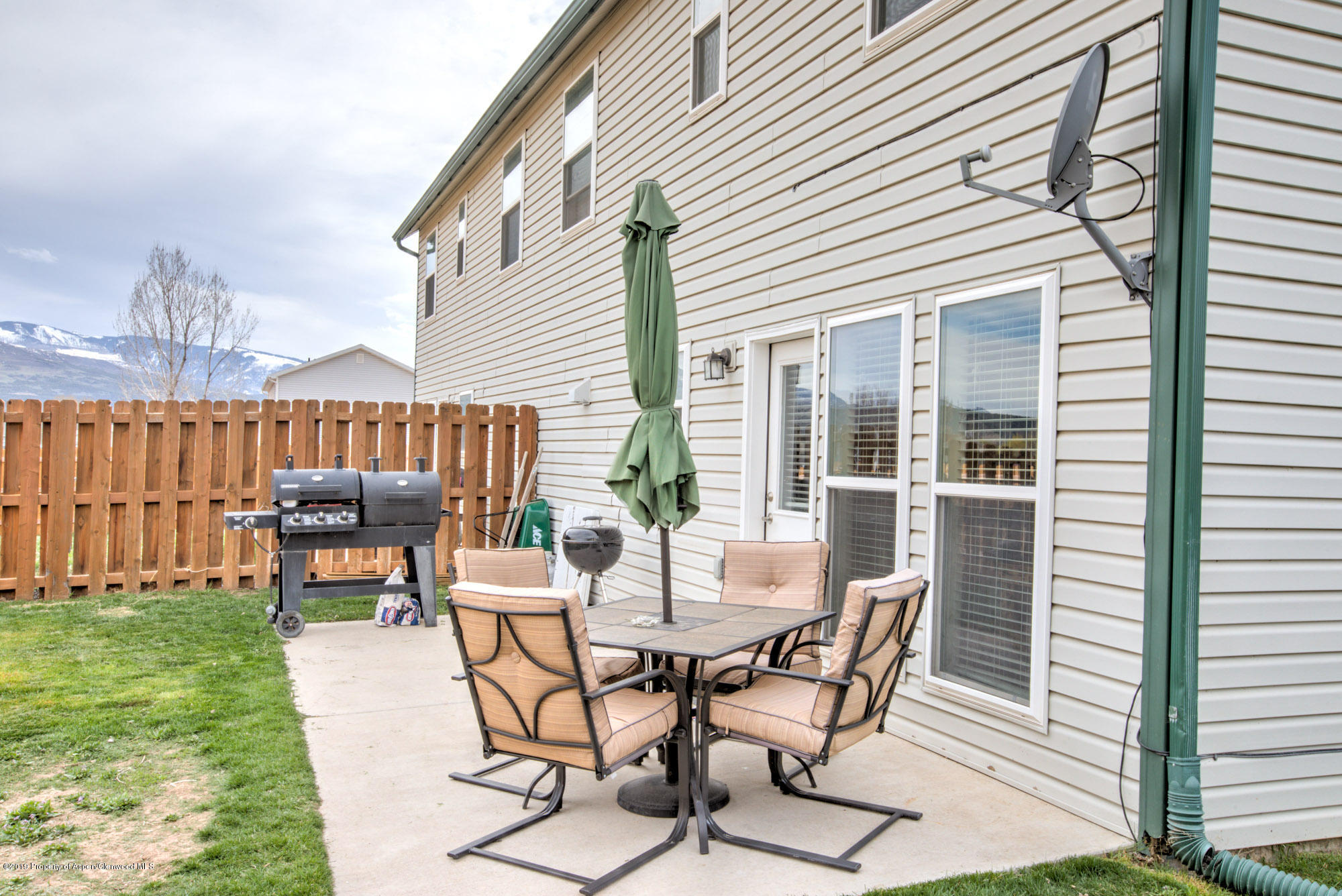 779 East 17th Street Rifle, CO 81650 - Photo 21 of 21 a view of a patio with a table and chairs and potted plants