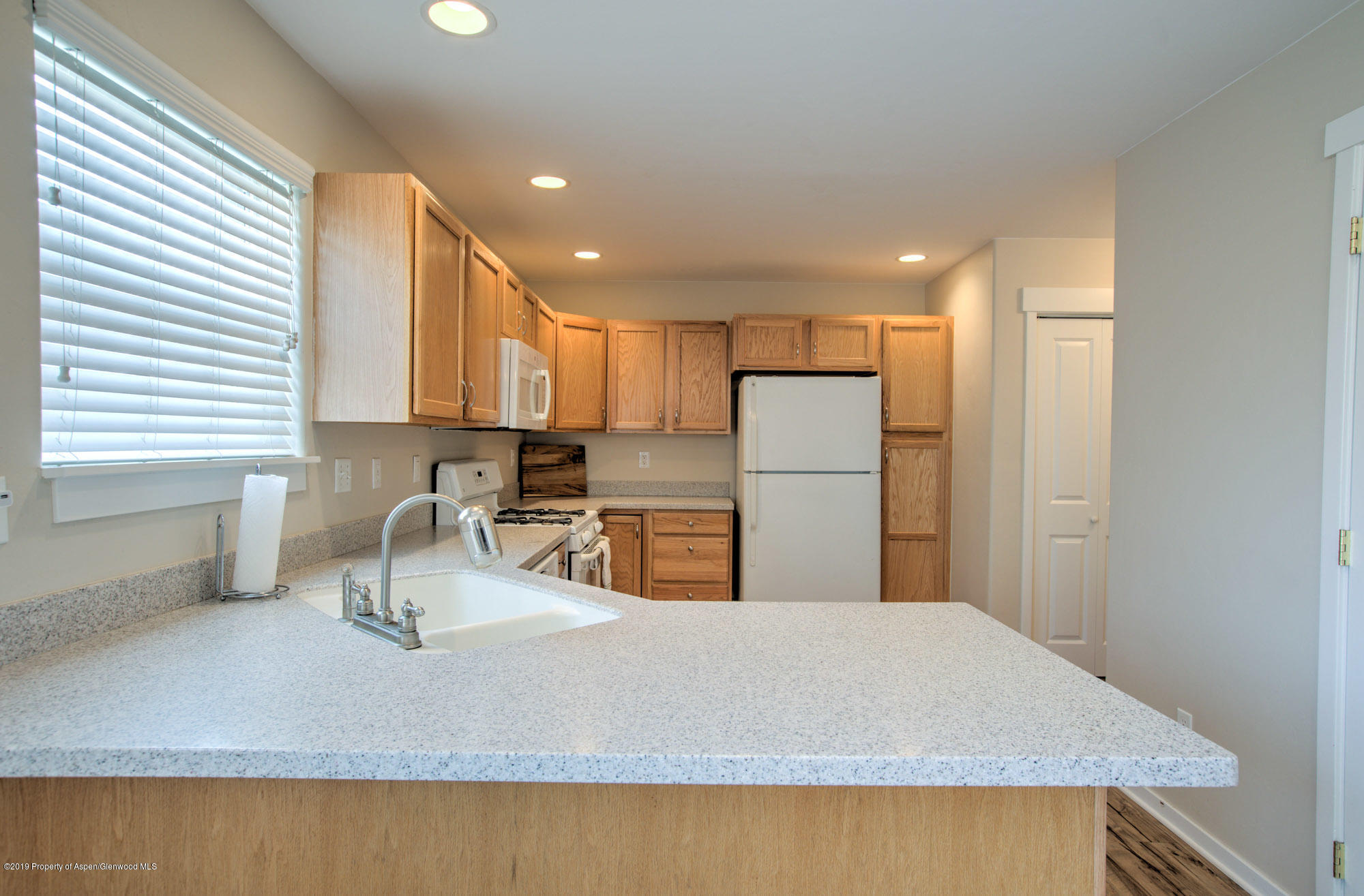 779 East 17th Street Rifle, CO 81650 - Photo 9 of 21 a kitchen with refrigerator and a sink